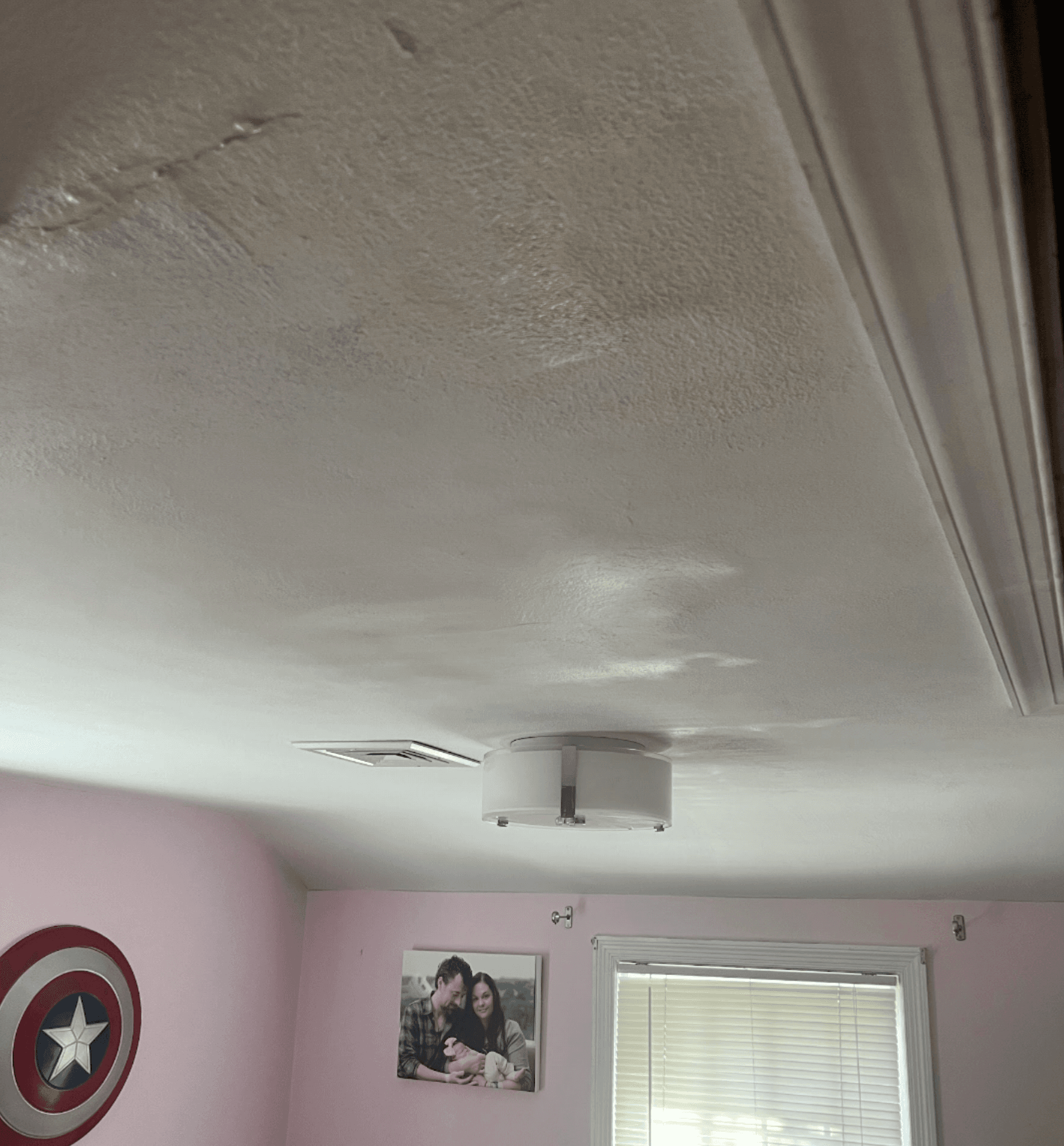 Water damaged nursery ceiling after Six HVAC AC installation — staining and bubbling across ceiling
